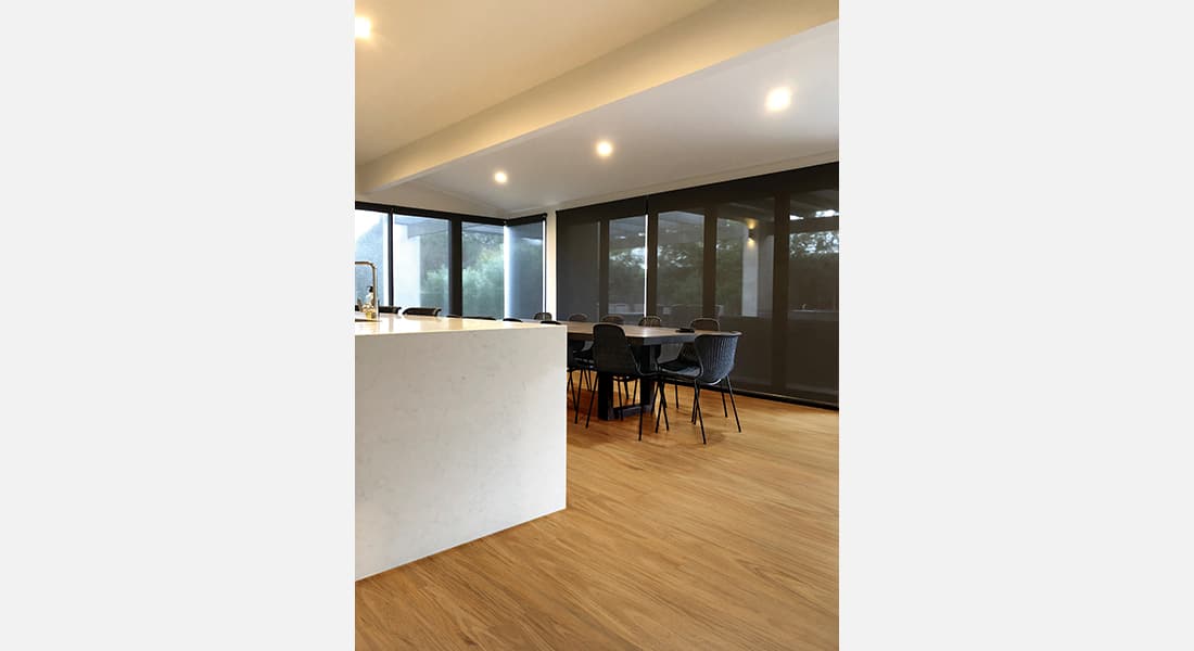 Residential Flooring - Hybrid Flooring, Summerville, Bunya Blackbutt | Open living kitchen with wood flooring | hybrid planks | hybrid flooring | floating floorboards | oak flooring